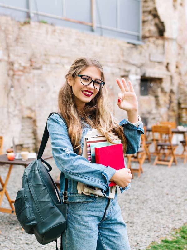 Girl waving at camera